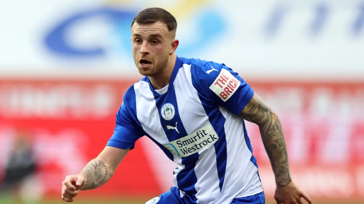 Last-minute goal by Dale Taylor secures a draw for Wigan against Northampton